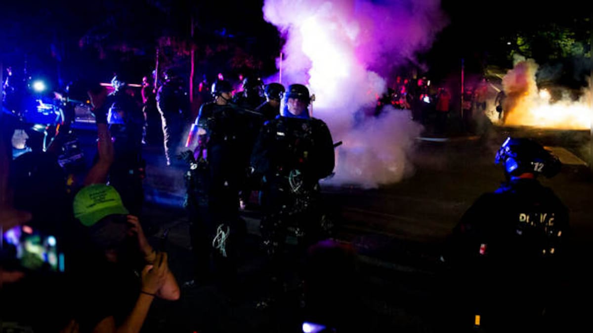 Portland Police declares demonstration outside law enforcement building 'riot', uses smoke to clear crowd