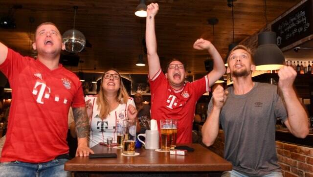 FC Bayern Munich fans celebrate the first goal for the club during Champions League final in a bar in Munich. AFP