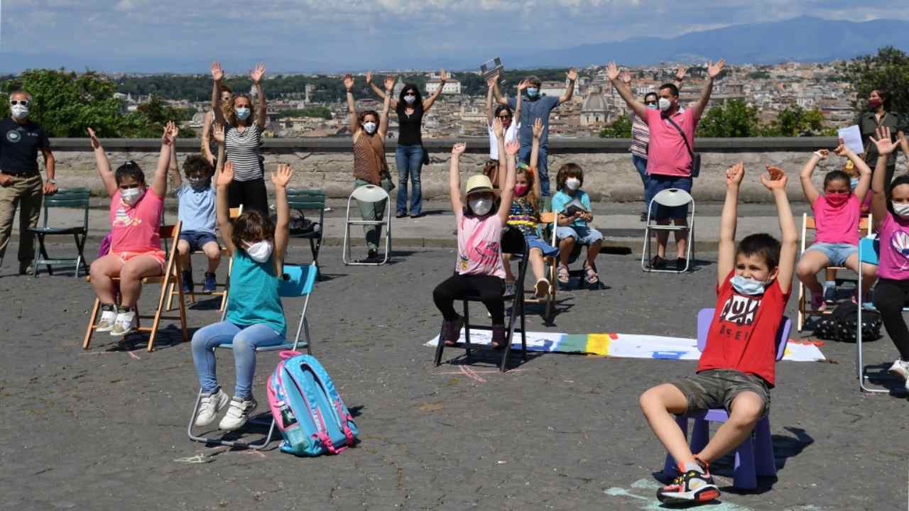 Parents and students from a public primary and secondary school in Rome take part in an 