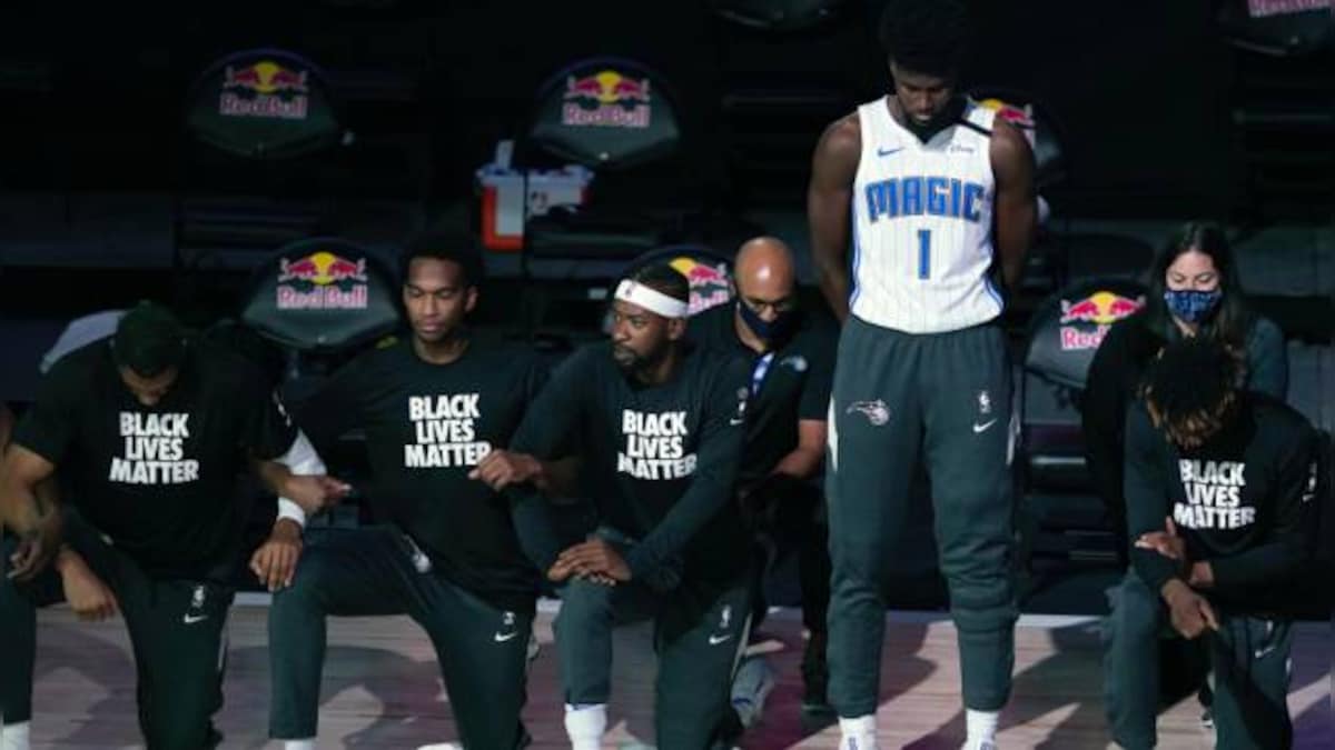 NBA: Gregg Popovich, Jonathan Isaac, Becky Hammon choose to stand for anthem in bubble