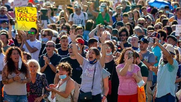 'We are not afraid': Hundreds protest in Madrid against face masks, other COVID-19 restrictions