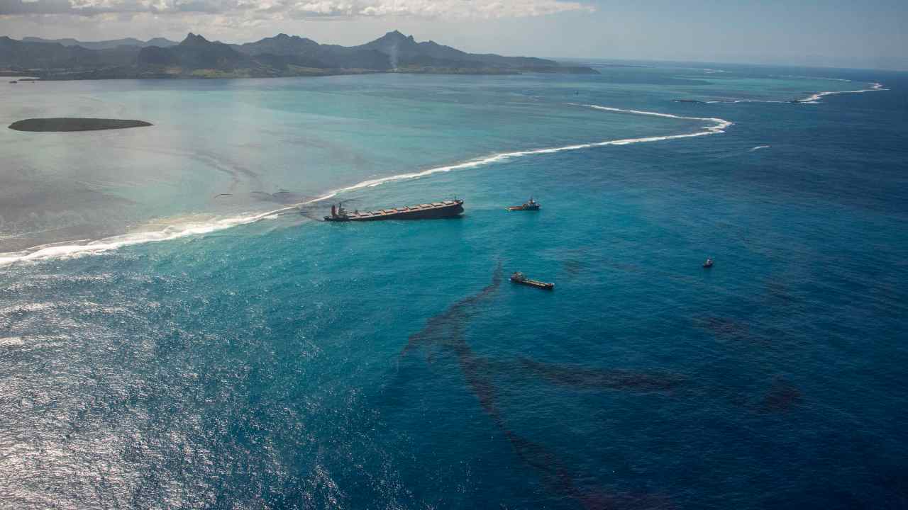 As per this 9 August photo, oil is still leaking out of the MV Wakashio after running aground on a coral reef. Image credit: French Defense Ministry/AP