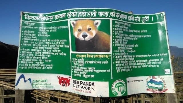 A Red Panda Network conservation banner in the village of Jaubari, Nepal, near SNP. Image via The Third Pole/ Sangay Tamang
