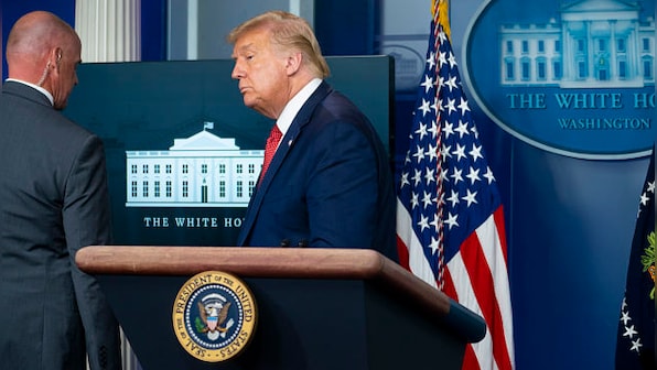 Donald Trump leaves briefing room after shooting outside White House, returns soon after