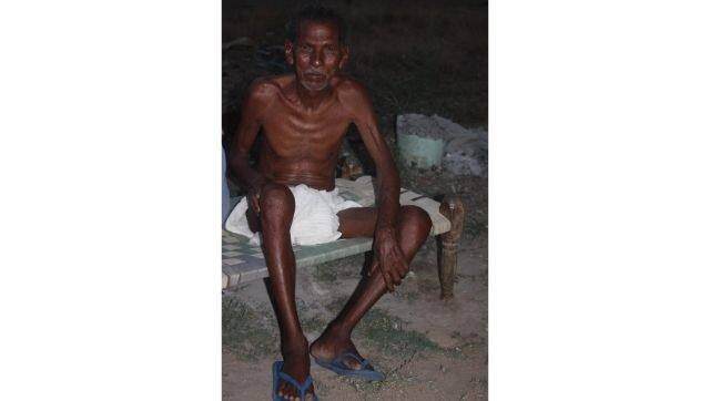95-year-old Shatrughan Chhatriya outside his house in Balangir