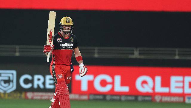AB de Villiers celebrates scoring his half-century. The South African could only build a 33-run stand for the third wicket with Kohli before the skipper was dismissed for a rare low score of 14. However, fifties from Padikkal and de Villiers later led the Bangalore franchise to 163-5 Sportzpics