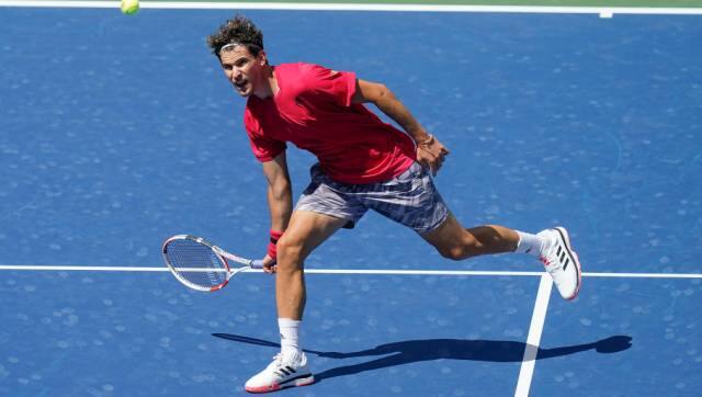 Dominic Thiem, of Austria, returns a shot to Jaume Munar, of Spain, during the first round of the US Open tennis championships, Tuesday, Sept. 1, 2020, in New York. (AP Photo/Seth Wenig)