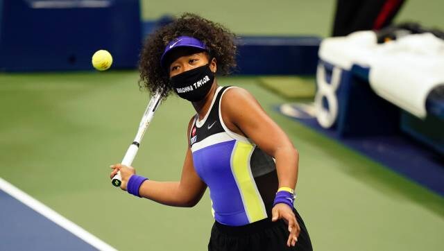 Naomi Osaka, of Japan, wears a mask in honor of Breonna Taylor as she celebrates after defeating Misaki Doi, of Japan, during the first round of the US Open tennis championships, Monday, Aug. 31, 2020, in New York. (AP Photo/Frank Franklin II)