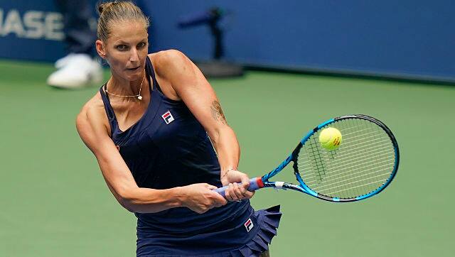 Karolina Pliskova, of the Czech Republic, returns a shot to Anhelina Kalinina, of the Ukraine, during the first round of the US Open tennis championships, Monday, Aug. 31, 2020, in New York. (AP Photo/Frank Franklin II)