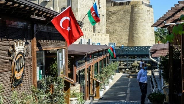 Both countries’ flags can be seen in the Azerbaijani capital Baku. AFP