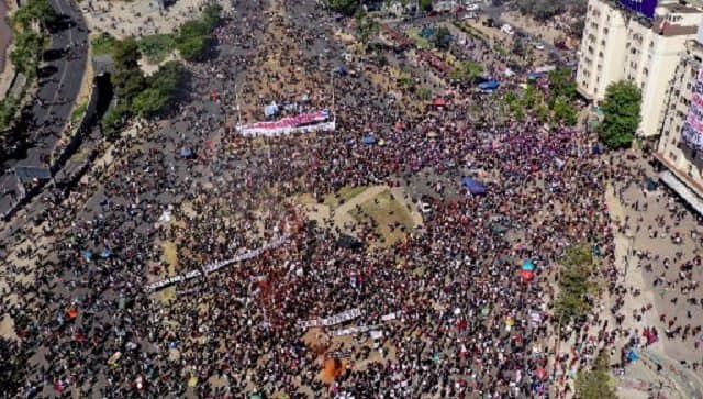 Aerial view of a demonstration with a banner reading 