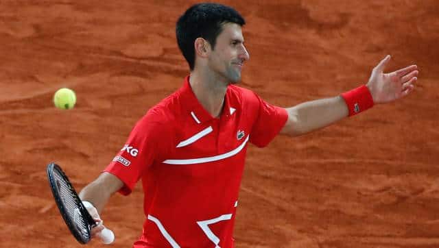 Serbia's Novak Djokovic reacts after missing a shot against Spain's Rafael Nadal in the final match of the French Open tennis tournament at the Roland Garros stadium in Paris, France, Sunday, Oct. 11, 2020. (AP Photo/Alessandra Tarantino)