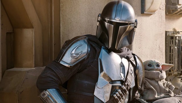 Mando with breakout star Baby Yoda in The Mandalorian Season 2