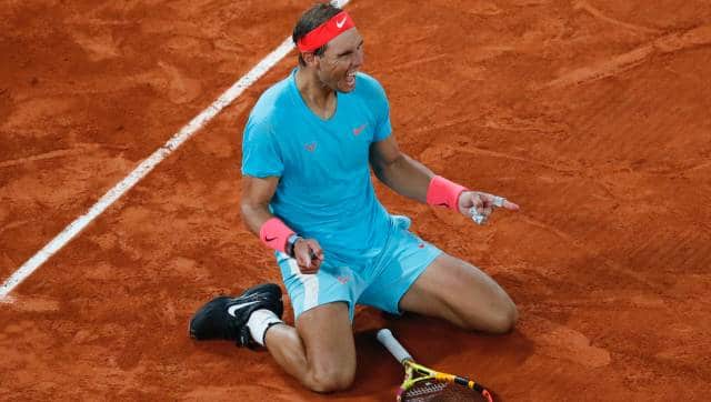 Spain's Rafael Nadal celebrates winning the final match of the French Open tennis tournament against Serbia's Novak Djokovic in three sets, 6-0, 6-2, 7-5, at the Roland Garros stadium in Paris, France, Sunday, Oct. 11, 2020. (AP Photo/Christophe Ena)