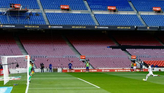 Real Madrid's Sergio Ramos kicks a penalty scoring his side's 2nd goal during the Spanish La Liga soccer match between FC Barcelona and Real Madrid at the Camp Nou stadium in Barcelona, Spain, Saturday, Oct. 24, 2020. (AP Photo/Joan Monfort)