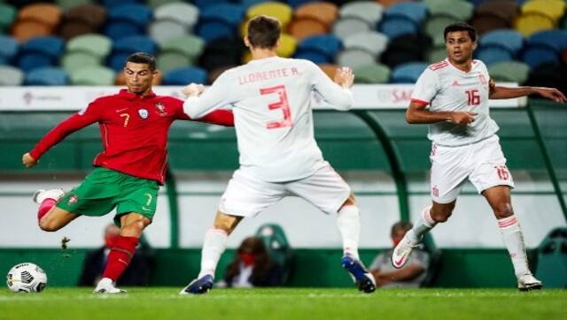 Portugal’s forward Cristiano Ronaldo vies with Spain’s defender Diego Llorente during the friendly football match between Portugal and Spain at the Jose Alvalade stadium in Lisbon. AFP 