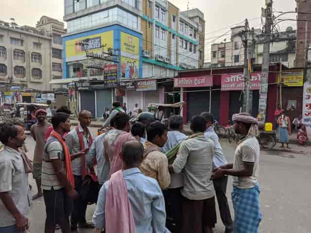 At Dinkar Chowk in Patna, daily wage labourers pounch on the motorcyclist looking for any menial job. Firstpost/Devparna Acharya