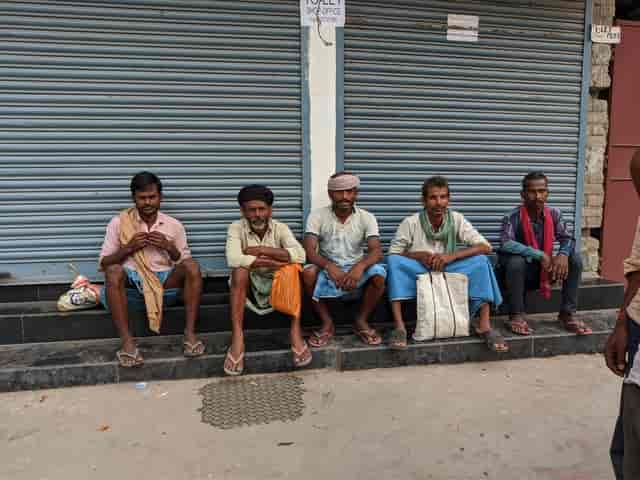 Daily wage labourers wait in hope of employment at the Bhattacharya Chowk in Patna. Firstpost/Devparna Acharya