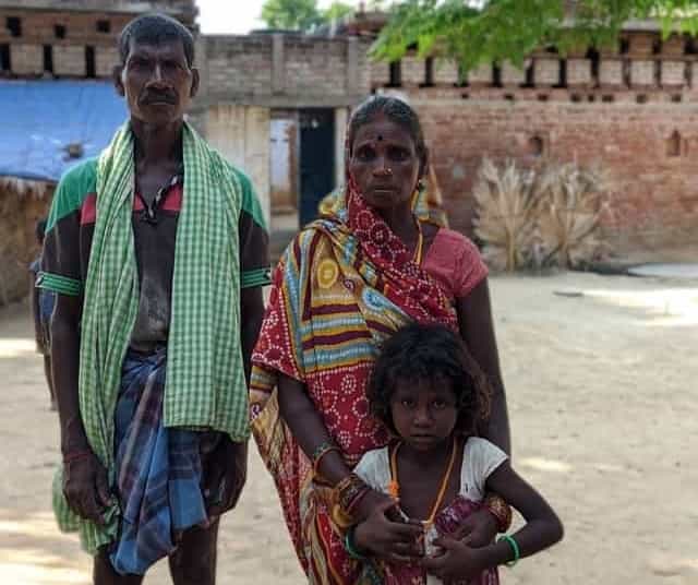 Rampiyari with her husband and her granddaughter in Hamzapur. Devparna Acharya/Firstpost