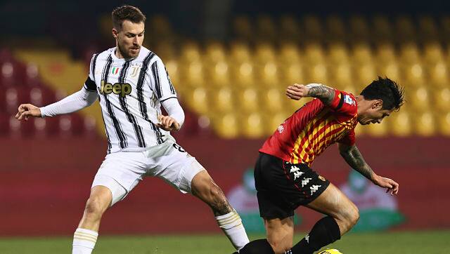 Juventus' Aaron Ramsey and Benevento's Gianluca Lapadula vie for the ball during their Serie A match. AP