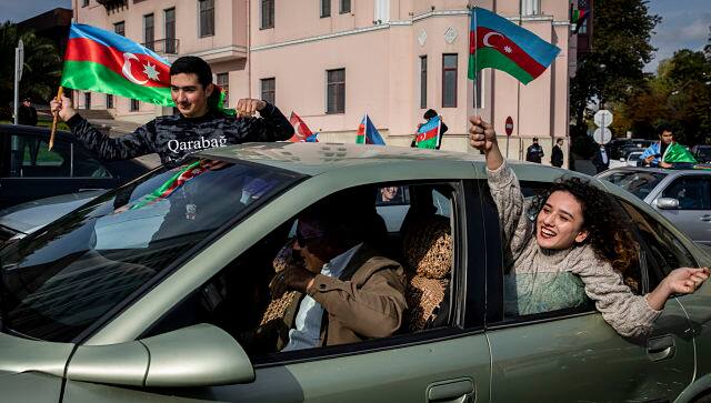 Azeris celebrate one week after a peace deal over the disputed Nagorno Karabakh territory in Baku, Azerbaijan. By Ivor Prickett © 2020 The New York Times