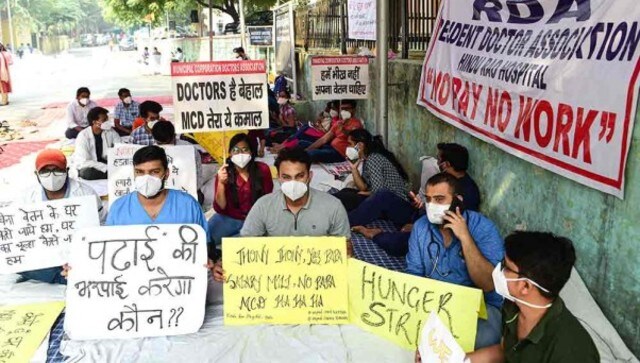 Resident doctors of Kasturba Hospital protest over non-payment of salaries by North Delhi Municipal Corporation. PTI