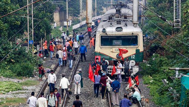 Activists of different parties block a railway track in Kolkata during a nationwide strike called by various trade unions on Thursday. AP