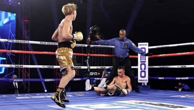 Japanese boxer Naoya Inoue (L) reacts after knocking down Australian boxer Jason Moloney during their bantamweight title bout at MGM Grand Conference Center on October 31, 2020 in Las Vegas, Nevada. (Photo by Mikey WILLIAMS / GETTY IMAGES NORTH AMERICA / AFP) / ----IMAGE RESTRICTED TO EDITORIAL USE - STRICTLY NO COMMERCIAL USE-----