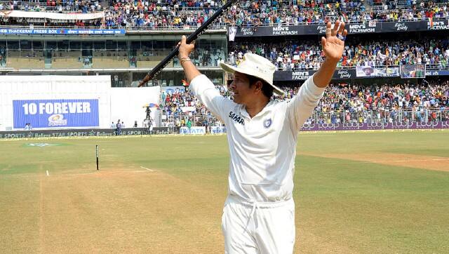 Sachin Tendulkar waves to the crowd before walking off the Wankhede pitch for the last time. BCCI 