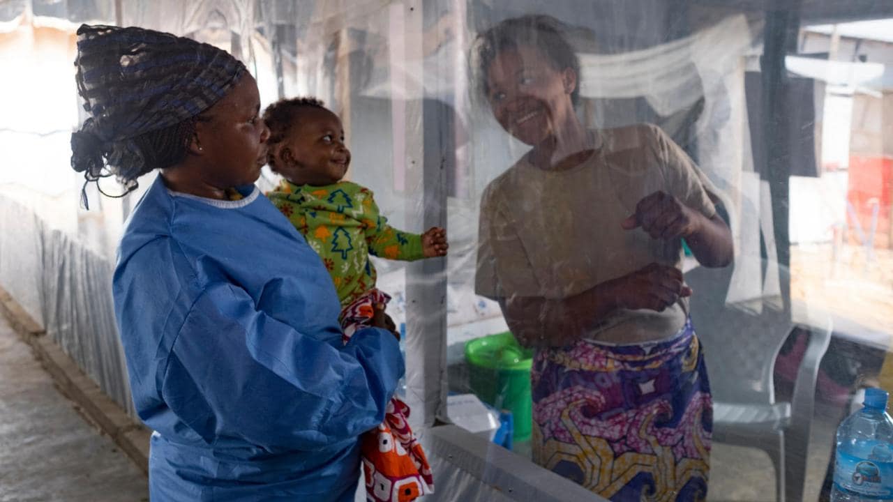 A plastic sheet separates 5 month-old Guerrishon from his mother, Collette, who is a patient at an Ebola Treatment Centre in Beni, North Kivu province. Image credit: UNICEF