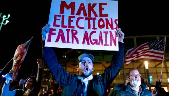 Trump supporter Jake Contos chants during a protest against the election results outside the central counting board in Detroit. AP 