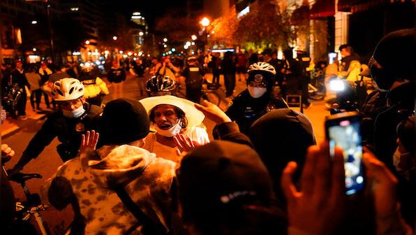 MAGA March in Washington: Donald Trump supporters clash with counter-protesters as night falls