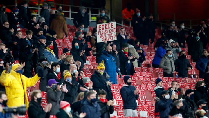 Shut out for nine months, Arsenal fans celebrate team's thumping win at Emirates Stadium