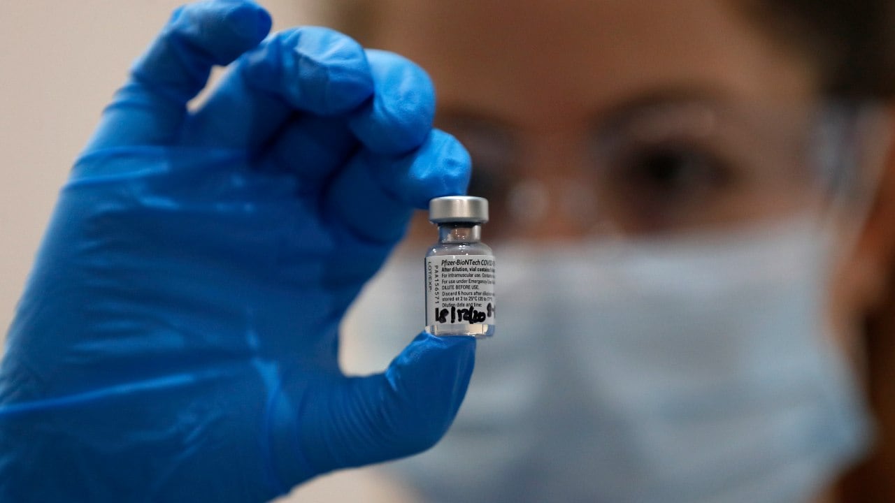 A nurse holds a vial of the Pfizer-BioNTech COVID-19 vaccine at Guy's Hospital in London, Tuesday, Dec. 8, 2020, as the U.K. health authorities rolled out a national mass vaccination program. Image credit: AP Photo/Frank Augstein
