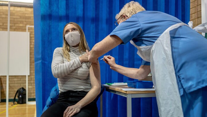 As UK begins vaccinations, Britons get a glimpse of life after COVID-19