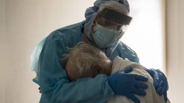 Hospital staff 'truly exhausted,' says Texas doctor on viral photo of him hugging elderly COVID-19 patient