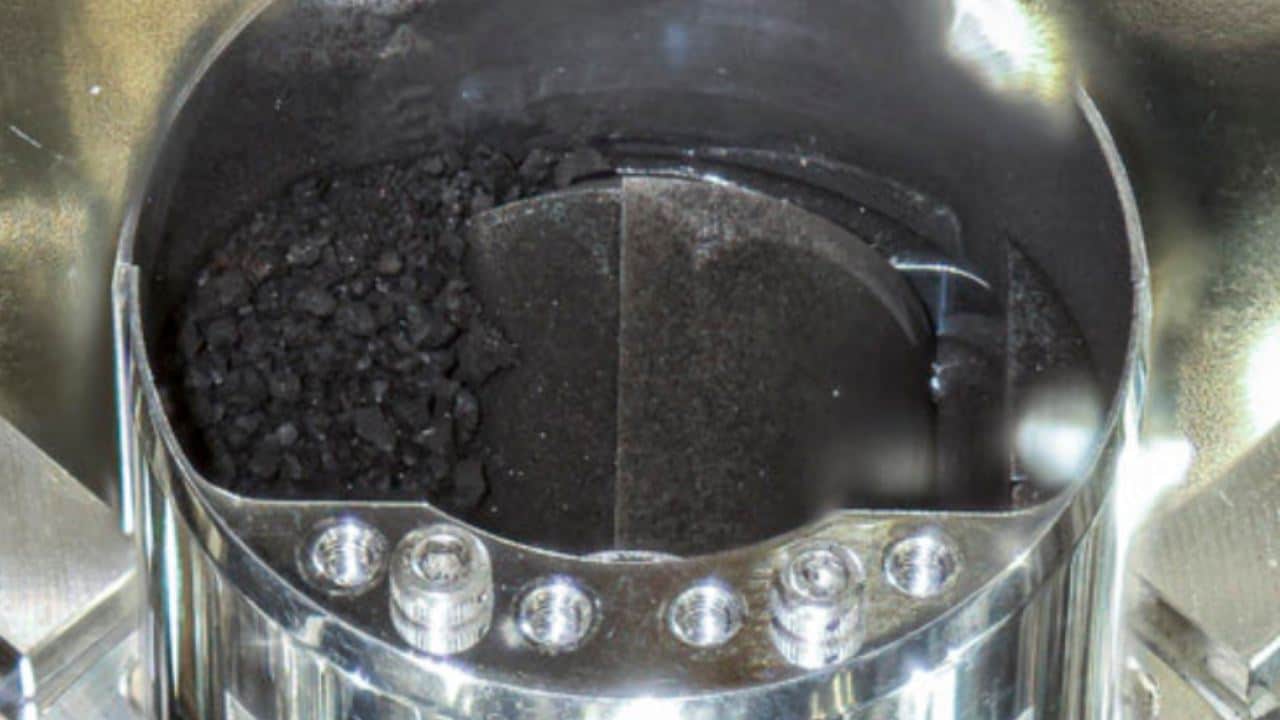 This images shows shows soil samples, seen inside C compartment of the capsule brought back by Hayabusa2, in Sagamihara, near Tokyo. Japanese space officials said Thursday they found more asteroid soil samples collected and brought back from the Hayabusa2 spacecraft, in addition to black sandy granules they found last week, raising their hopes of finding clues to the origins of the solar system.  Image credit: Twitter/JAXA