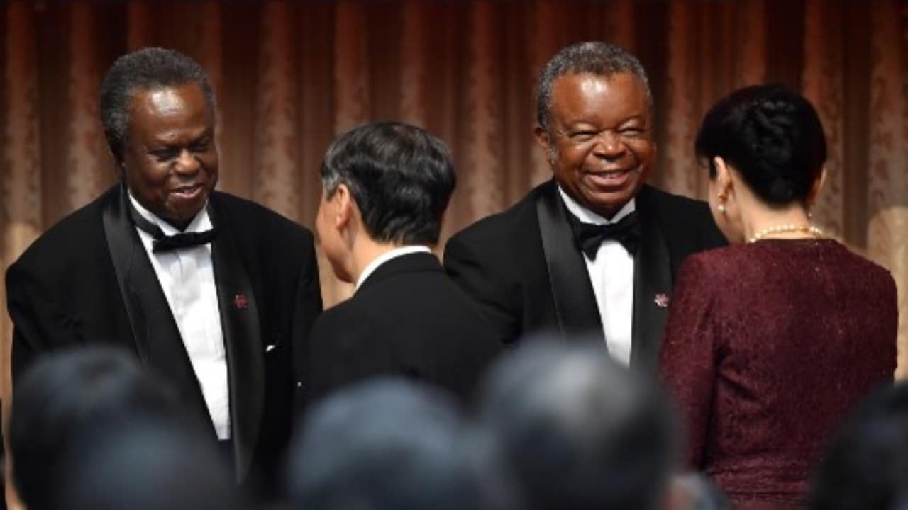 The Third Hideyo Noguchi Africa Prize winners, Francis Gervase Omaswa of Uganda (L) and Jean-Jacques Muyembe-Tamfum of Congo (2nd R) are greeted by Japan's Emperor Naruhito (2nd L) and Empress Masako (R) at the end of the awards ceremony in Tokyo on August 30, 2019 on the sidelines of the Tokyo International Conference on African Development (TICAD). Image credit: Kazuhiro NOGI / AFP