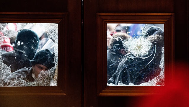 Pro-Trump protesters storm the Capitol in Washington last week. By Erin Schaff © 2021 The New York Times
