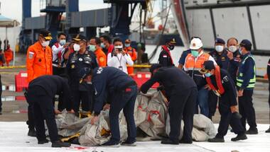 Indonesian search team recovers black box at plane crash site; hunt for cockpit voice recorder still on