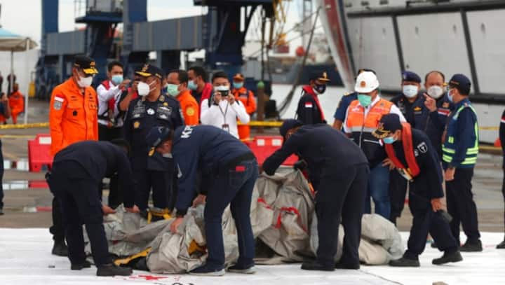 Indonesian search team recovers black box at plane crash site; hunt for cockpit voice recorder still on