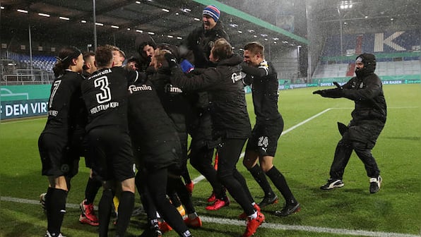 German Cup: Bayern Munich knocked out of tournament for first time in 20 years by second-division team Holstein Kiel