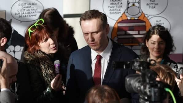 'I am not afraid': Kremlin critic Alexei Navalny detained on arrival at Moscow airport
