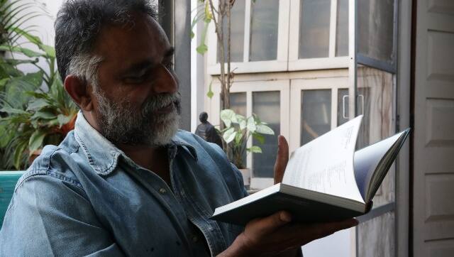 Suresh Jayaram with the cookbook