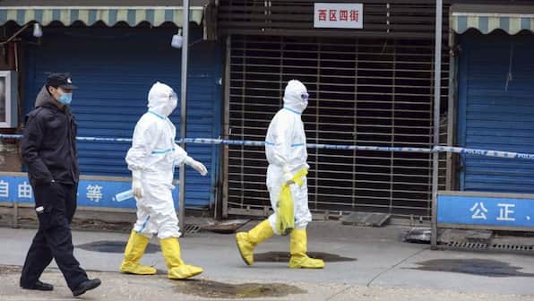 What are WHO researchers trying to learn about COVID-19 origins in Wuhan? Is the secrecy necessary?
