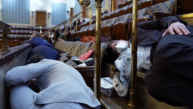 Lawmakers were told to duck under their seats for cover and put on gas masks after tear gas was used in the Capitol Rotunda. Some House lawmakers tweeted they were sheltering in place in their offices. Rep. Scott Peters, D-Calif., told reporters he was in the House chamber when rioters began storming it. Security officers “made us all get down, you could see that they were fending off some sort of assault, it looked like. They had a piece of furniture up against the door. Image courtesy: AP Lawmakers were told to duck under their seats for cover and put on gas masks after tear gas was used in the Capitol Rotunda. Some House lawmakers tweeted they were sheltering in place in their offices. Rep. Scott Peters, D-Calif., told reporters he was in the House chamber when rioters began storming it. Security officers “made us all get down, you could see that they were fending off some sort of assault, it looked like. They had a piece of furniture up against the door. Image courtesy: AP