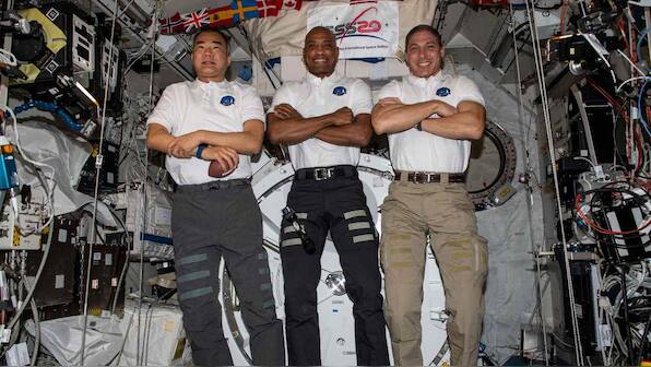 Spacewalking astronauts encounter cable trouble while hooking up European lab