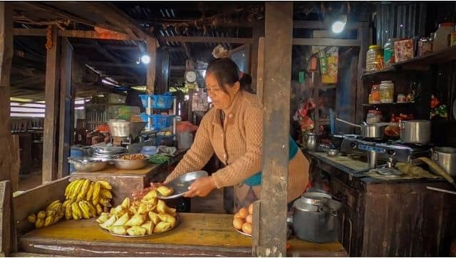 Gyanu Maya Shrestha pictures at her shop in Hepne in Dhading district. Photo by Nabin Baral/The Third Pole