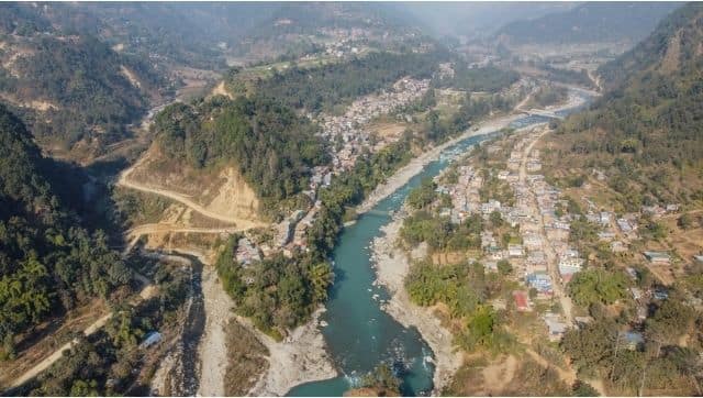 A drone shot of Arugath Bazaar, one of the biggest settlements on the Budhi Gandaki River valley bordering Gorkha and Dhading district in Nepal. The bazaar will be submerged in water. Photo by Nabin Baral
