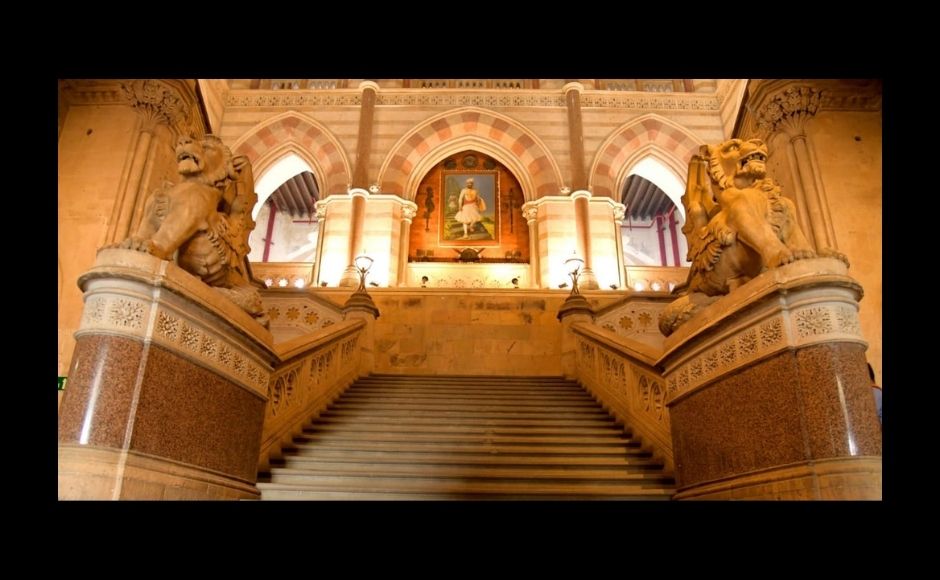 Shown above in the picture is the entrance for corporation staff and public. The Mayor and corporators have a separate entrance. The winged lions with serpent tails, on both sides of the staircase, show dominance over land, air and water - inspired by Venetian lions. Mayor's office was originally not part of the building; the mayor used to operate from his personal chambers. The office was added to the building on the insistence of Vithalbhai Patel that the people’s representative should also have an office in the building. The Mayor has a special chair that travels with her wherever she presides. Photograph courtesy of the BMC. Shown above in the picture is the entrance for corporation staff and public. The Mayor and corporators have a separate entrance. The winged lions with serpent tails, on both sides of the staircase, show dominance over land, air and water - inspired by Venetian lions. Mayor's office was originally not part of the building; the mayor used to operate from his personal chambers. The office was added to the building on the insistence of Vithalbhai Patel that the people’s representative should also have an office in the building. The Mayor has a special chair that travels with her wherever she presides. Photograph courtesy of the BMC.
